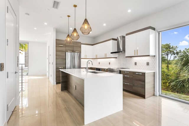 4240 NW 17th Ave, Boca Raton, FL 33431 - kitchen with wall chimney exhaust hood, stainless steel appliances, a sink, modern cabinets, and recessed lighting