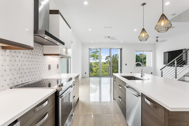 4240 NW 17th Ave, Boca Raton, FL 33431 - kitchen with appliances with stainless steel finishes, a sink, wall chimney range hood, modern cabinets, and open floor plan