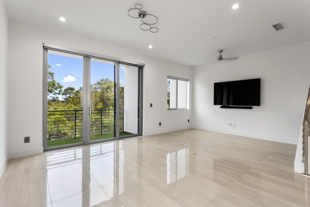 4240 NW 17th Ave, Boca Raton, FL 33431 - unfurnished living room with light tile patterned floors, a ceiling fan, baseboards, and recessed lighting