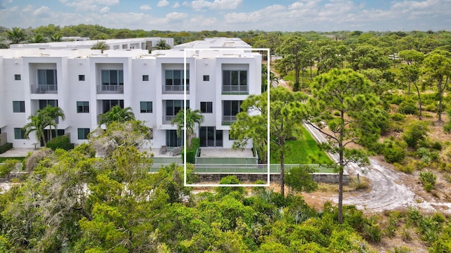 4240 NW 17th Ave, Boca Raton, FL 33431 - rear view of house featuring stucco siding
