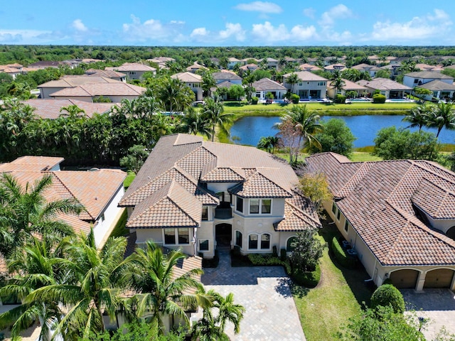 birds eye view of property with a residential view and a water view