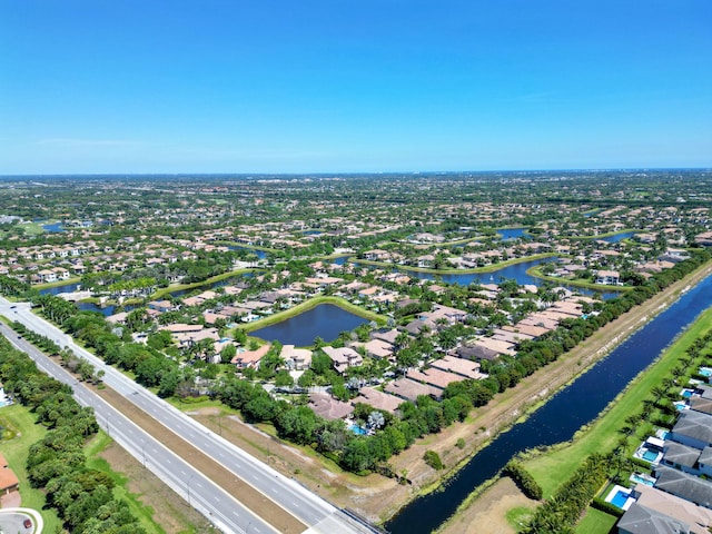 birds eye view of property with a water view and a residential view