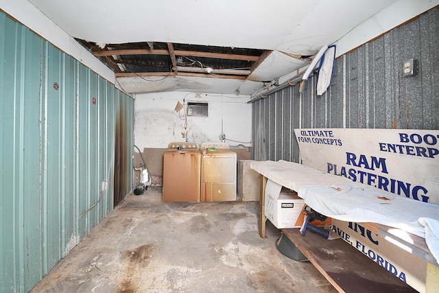unfinished basement featuring independent washer and dryer