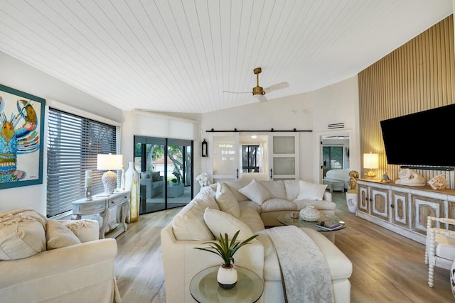 7527 Glendevon Ln Unit 805, Delray Beach, FL 33446 - living room with a ceiling fan, wooden ceiling, a barn door, and light wood-style floors