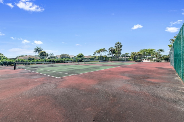 view of tennis court with fence