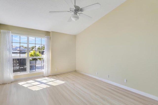 213 Ocean Dunes Cir, Jupiter, FL 33477 - unfurnished room featuring baseboards, lofted ceiling, ceiling fan, and light wood-style floors