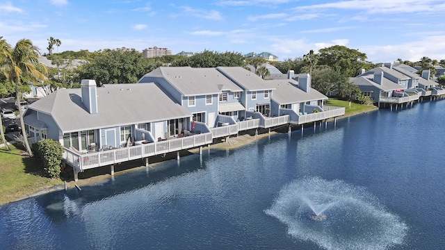 213 Ocean Dunes Cir, Jupiter, FL 33477 - rear view of property with a residential view, a water view, and a chimney
