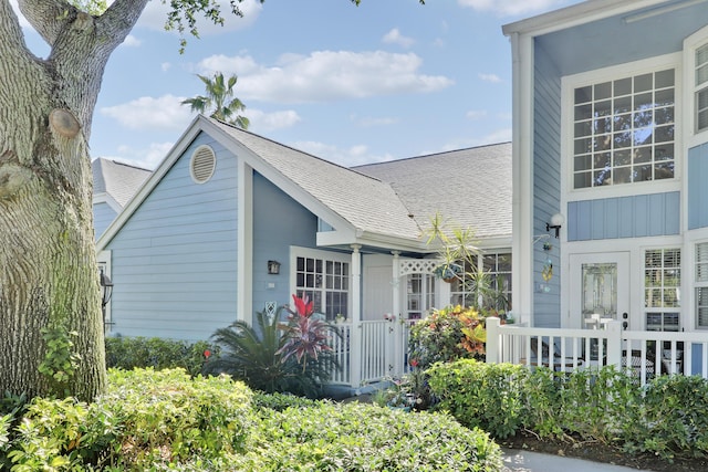 213 Ocean Dunes Cir, Jupiter, FL 33477 - exterior space featuring a porch and roof with shingles