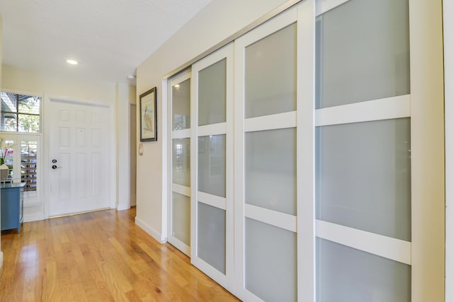213 Ocean Dunes Cir, Jupiter, FL 33477 - hallway with baseboards and light wood-style floors
