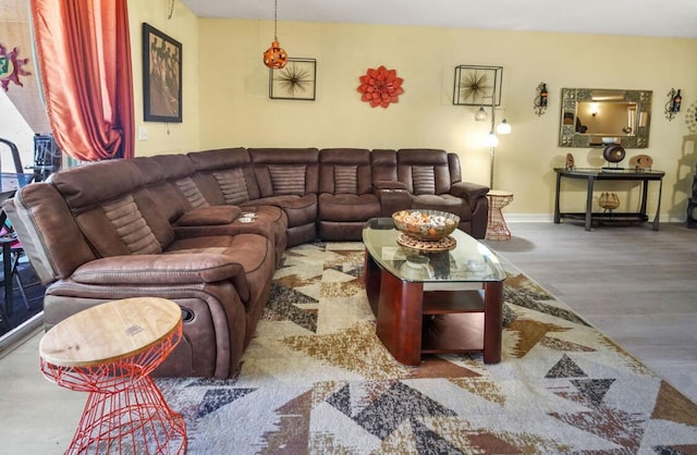 living area with wood finished floors and baseboards