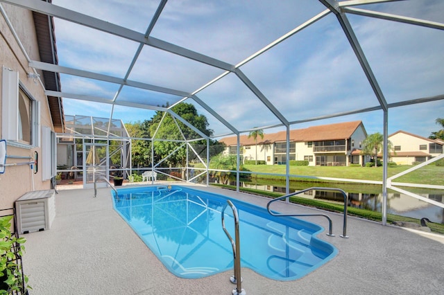 12693 Coral Breeze Dr, Wellington, FL 33414 - outdoor pool featuring a residential view, glass enclosure, a lawn, and a patio