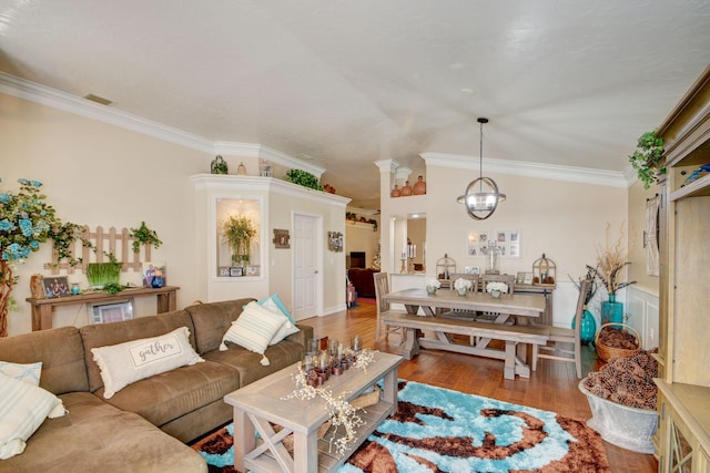 12693 Coral Breeze Dr, Wellington, FL 33414 - living area featuring wood finished floors, visible vents, an inviting chandelier, lofted ceiling, and ornamental molding