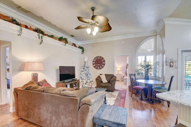 12693 Coral Breeze Dr, Wellington, FL 33414 - living room with visible vents, crown molding, light wood-style floors, and ceiling fan