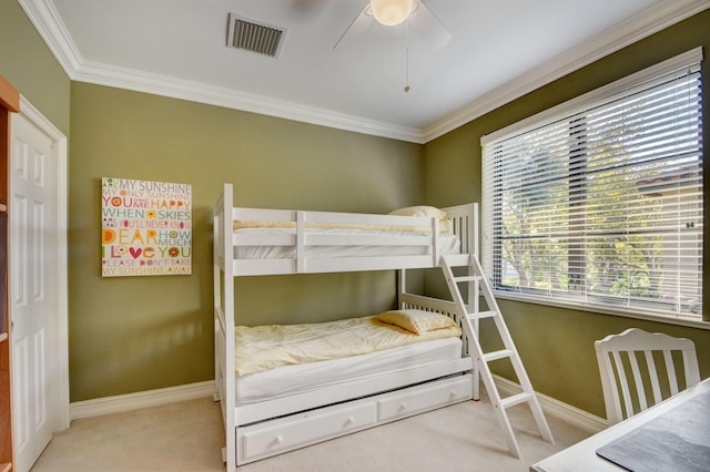 bedroom with visible vents, ornamental molding, baseboards, and carpet floors