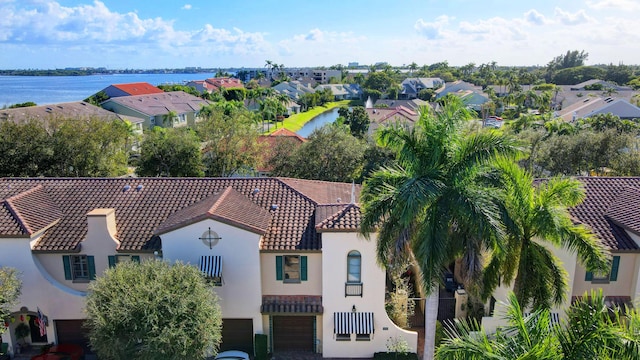 aerial view featuring a residential view and a water view