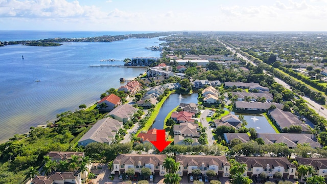 birds eye view of property featuring a residential view and a water view