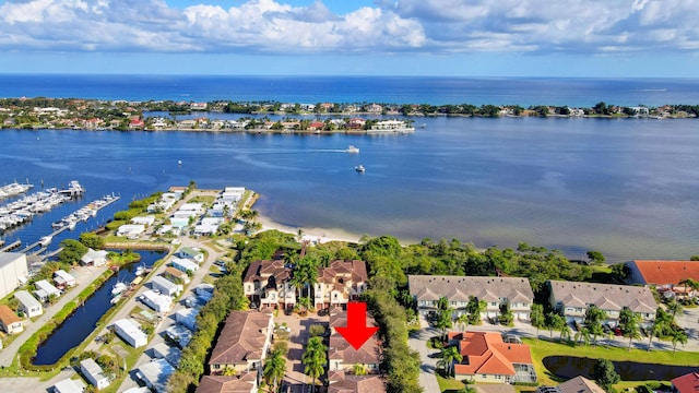 bird's eye view with a residential view and a water view