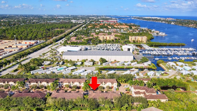 birds eye view of property featuring a residential view and a water view