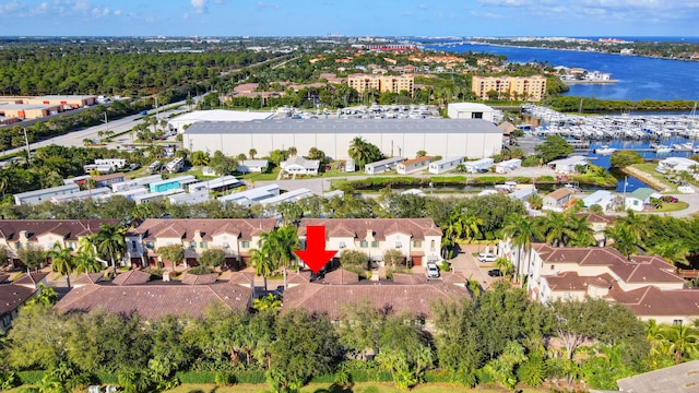 birds eye view of property with a residential view and a water view