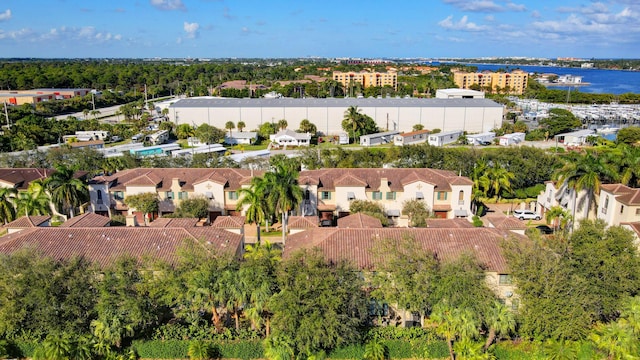 birds eye view of property with a residential view and a water view