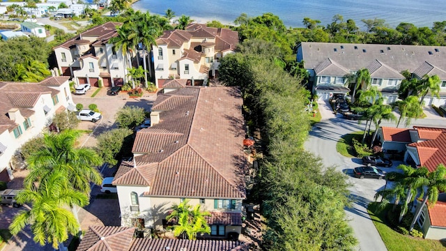 bird's eye view with a residential view and a water view