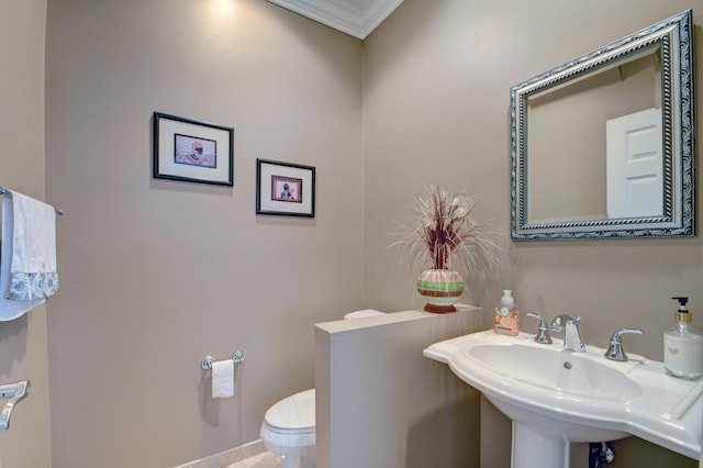 bathroom featuring a sink and toilet