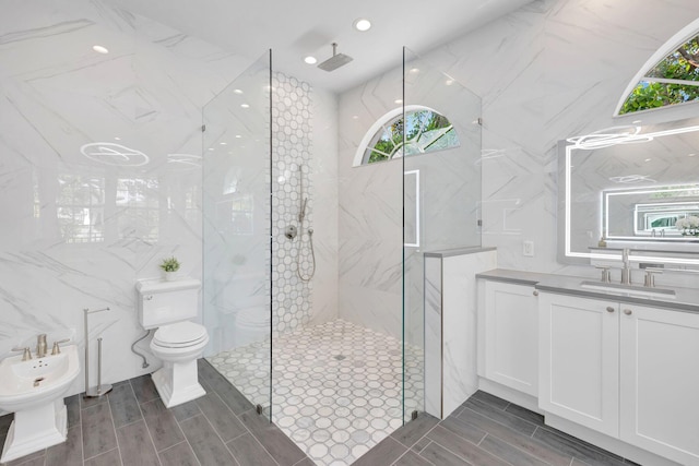 bathroom with a walk in shower, a bidet, vanity, and wood tiled floor