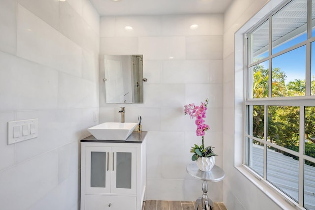 bathroom with vanity and wood finished floors