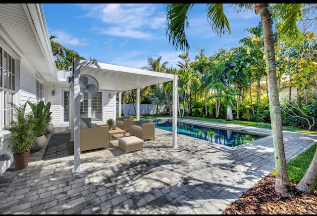 view of swimming pool with a patio area, an outdoor living space, fence, and a fenced in pool