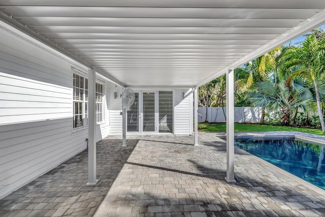 view of patio / terrace featuring a fenced in pool and fence