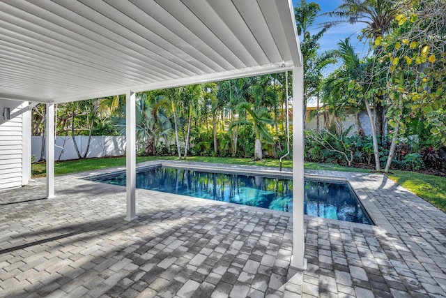 view of swimming pool with a fenced in pool, a patio, and a fenced backyard