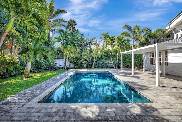 view of swimming pool with a patio, a fenced backyard, and a fenced in pool
