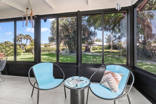 sunroom with beamed ceiling