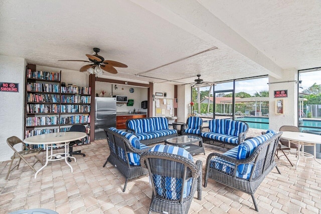 view of patio / terrace with an outdoor hangout area and ceiling fan