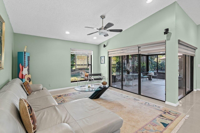 dining space with baseboards, high vaulted ceiling, visible vents, and tile patterned flooring