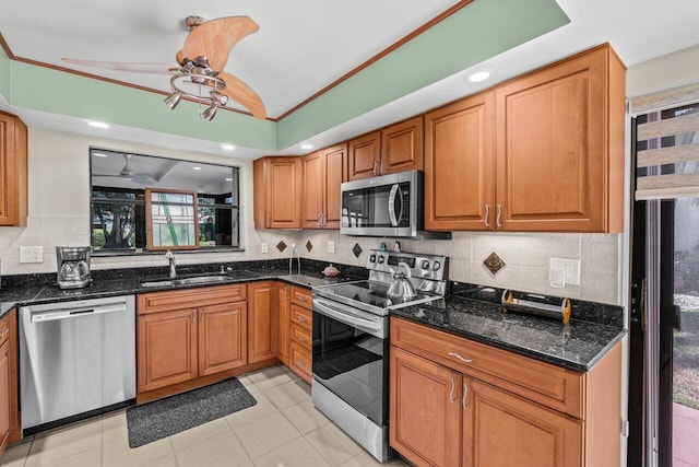 tiled living area featuring baseboards, a textured ceiling, lofted ceiling, and ceiling fan