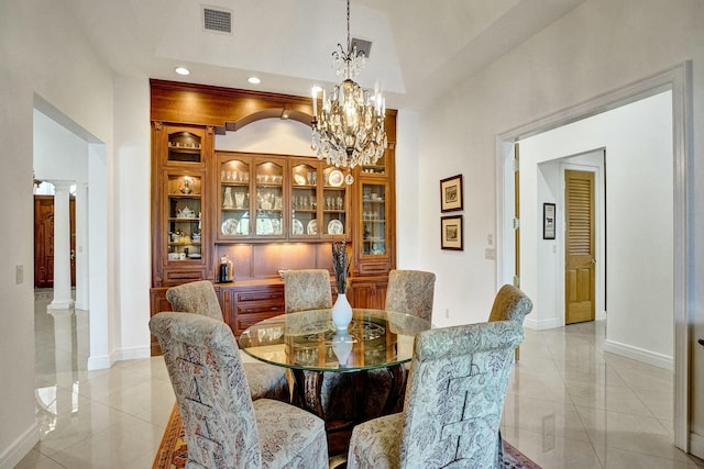 dining room with a notable chandelier, baseboards, recessed lighting, visible vents, and decorative columns