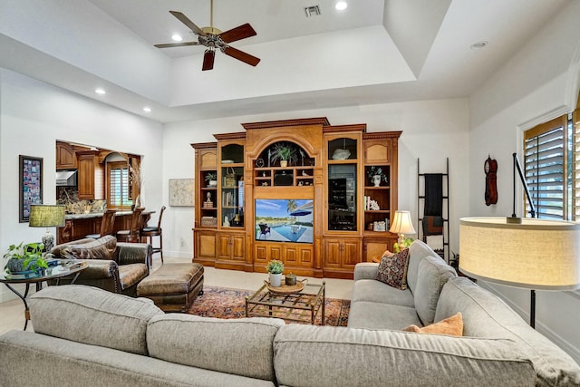 living room with recessed lighting, visible vents, baseboards, and ceiling fan