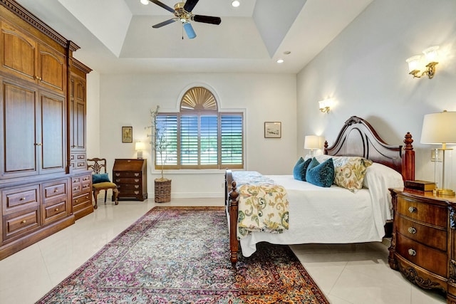bedroom featuring a tray ceiling, ceiling fan, recessed lighting, and light tile patterned flooring