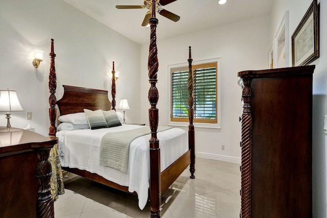 bedroom with light tile patterned flooring, baseboards, and a ceiling fan
