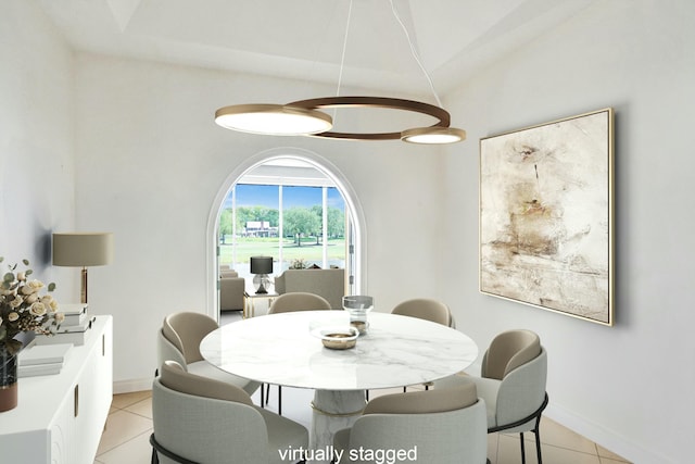 dining room with light tile patterned floors and baseboards