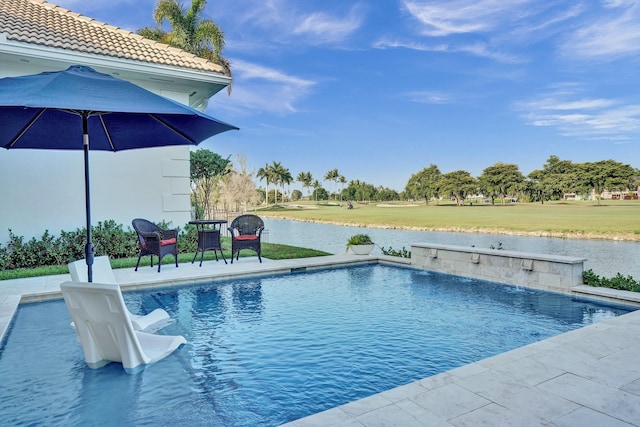 outdoor pool with a water view