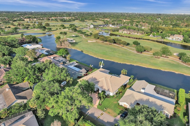 birds eye view of property with a water view, view of golf course, and a residential view