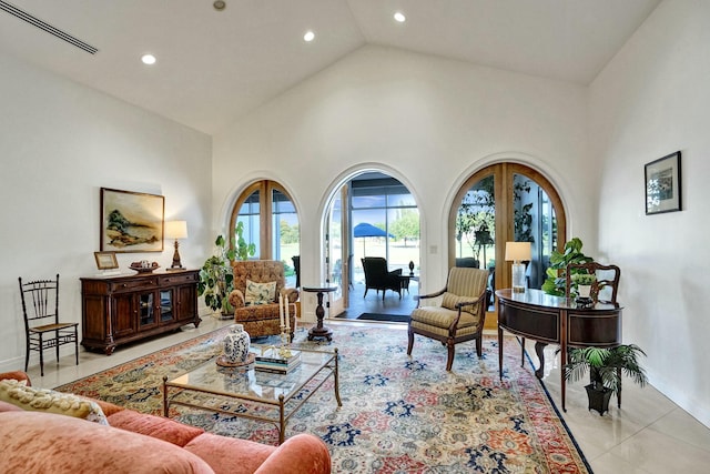 living room with visible vents, baseboards, recessed lighting, high vaulted ceiling, and light tile patterned flooring