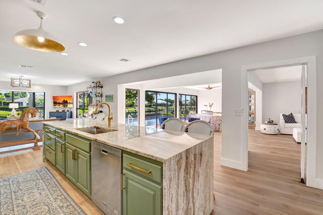 4730 S Lake Dr, Boynton Beach, FL 33436 - kitchen with green cabinetry, a sink, a wealth of natural light, and stainless steel dishwasher