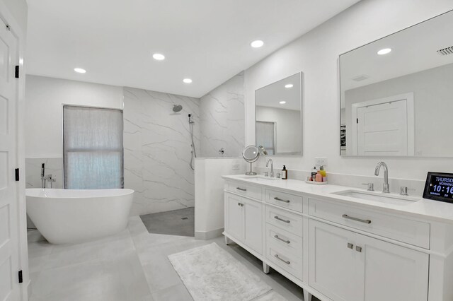 4730 S Lake Dr, Boynton Beach, FL 33436 - full bathroom with a marble finish shower, double vanity, a sink, and tile walls