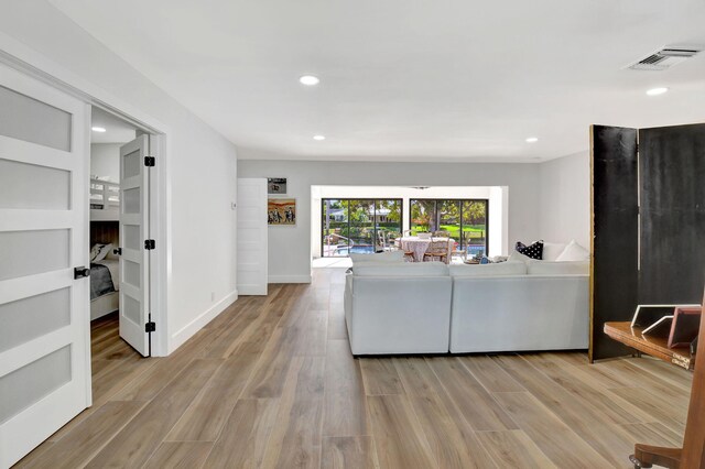 4730 S Lake Dr, Boynton Beach, FL 33436 - living area featuring recessed lighting, baseboards, light wood-style floors, and visible vents