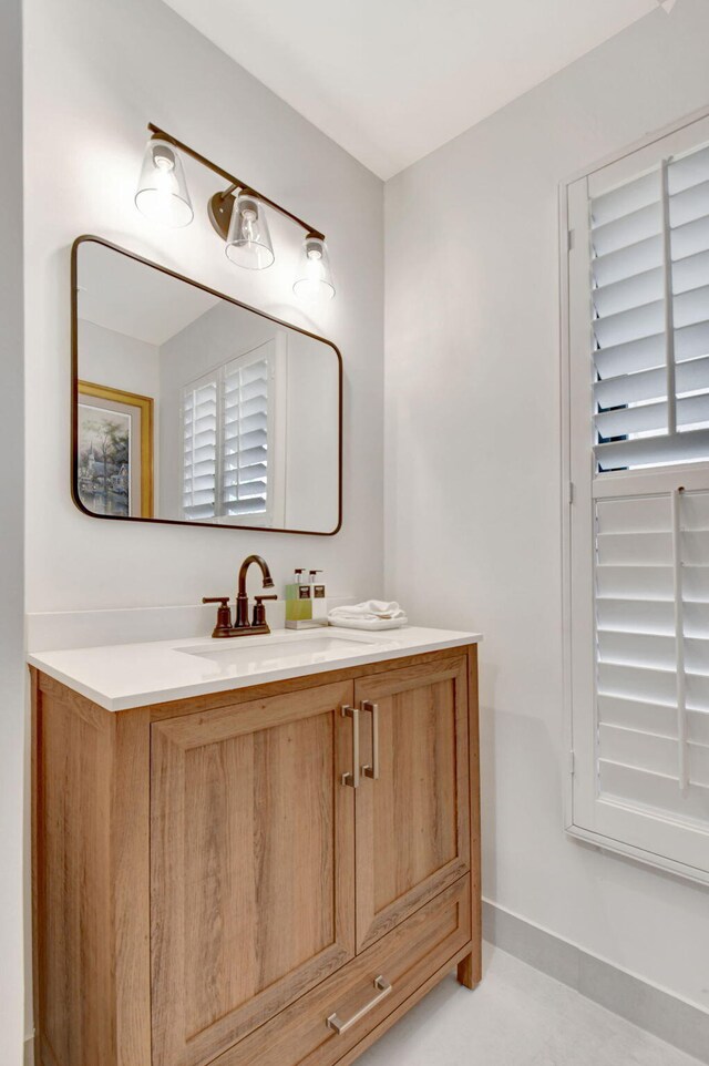 4730 S Lake Dr, Boynton Beach, FL 33436 - bathroom featuring baseboards and vanity