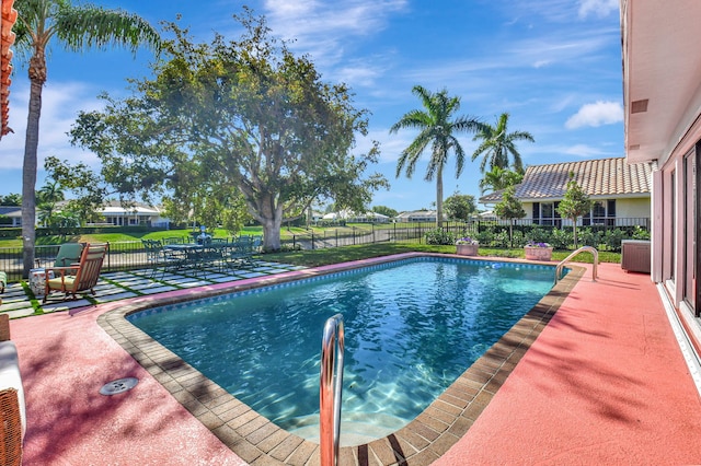 4730 S Lake Dr, Boynton Beach, FL 33436 - view of swimming pool featuring a fenced in pool, central AC unit, fence, and a patio