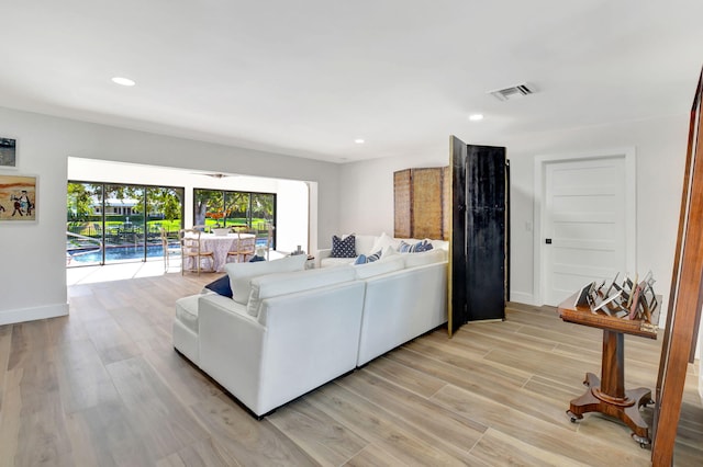 4730 S Lake Dr, Boynton Beach, FL 33436 - living area with baseboards, visible vents, recessed lighting, and light wood-type flooring